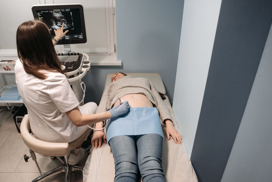 What Does Low Bilirubin Mean in a Blood Test? Causes and Risks - doctor abdominal exam