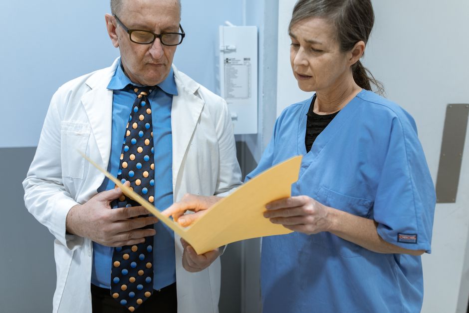 What Is AST and ALT in a Blood Test? The Two Liver Numbers and the Gap - doctor reviewing lab results