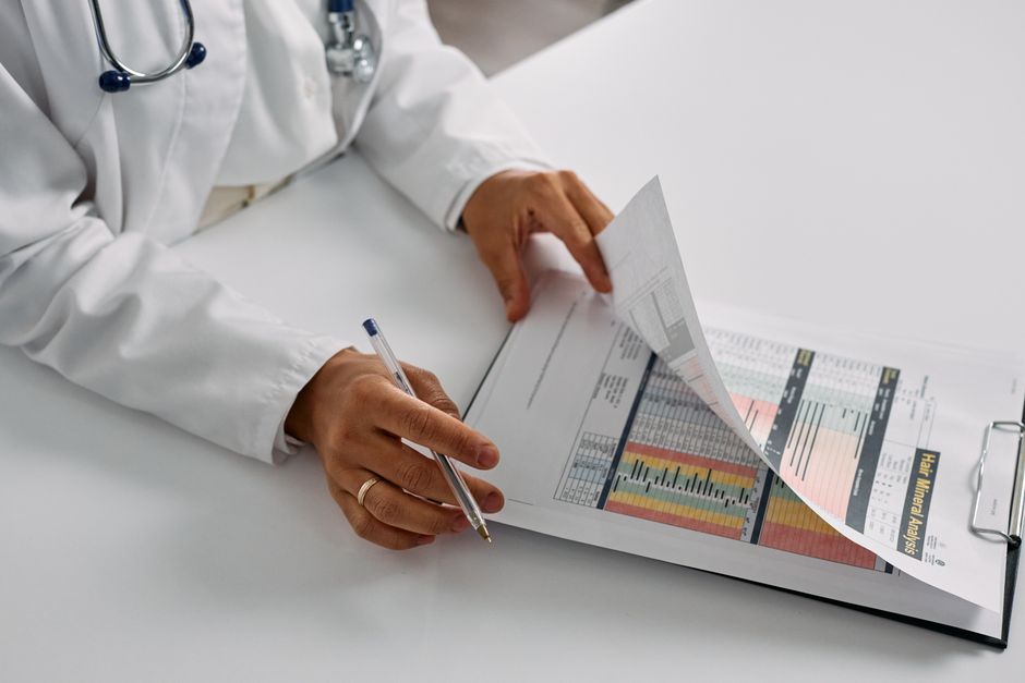 What Does High Triglycerides Mean in a Blood Test? Levels and Risks - doctor reviewing lab results