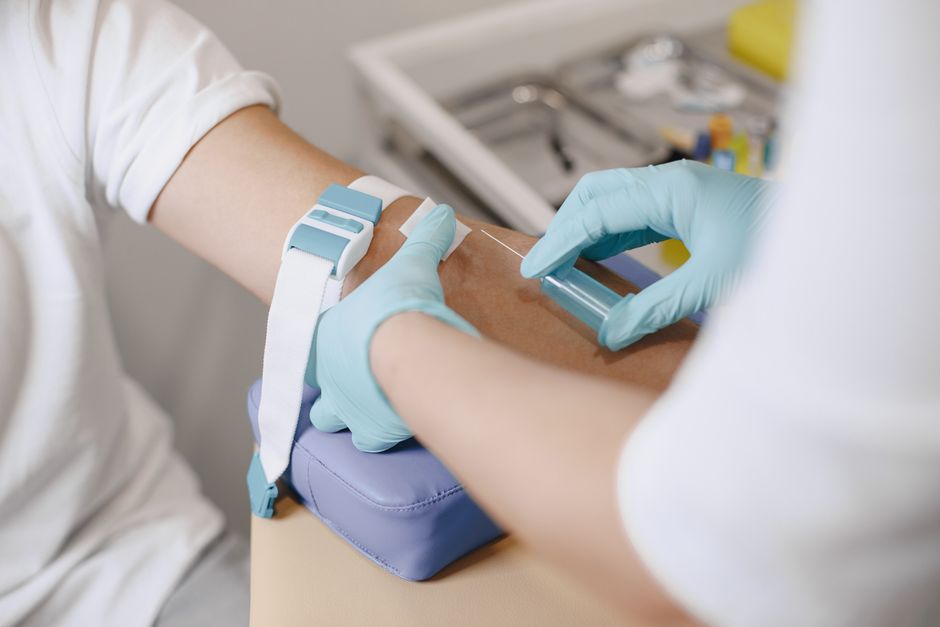 What Does High Triglycerides Mean in a Blood Test? Levels and Risks - phlebotomist drawing blood