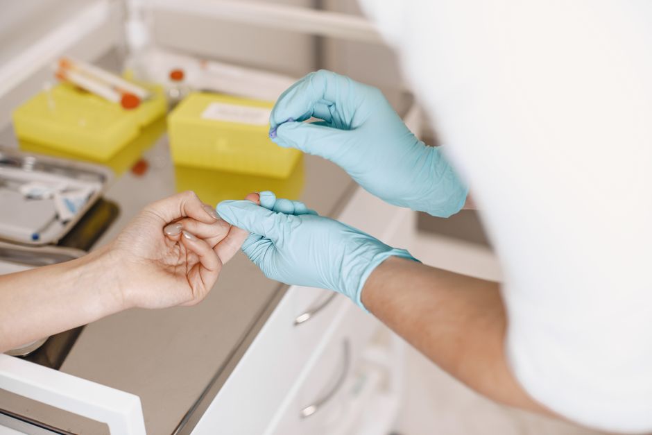 What Does High Chloride Mean in a Blood Test? Causes & When to Worry - phlebotomist drawing blood